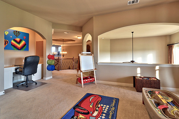 Gameroom open to Family Room volume.